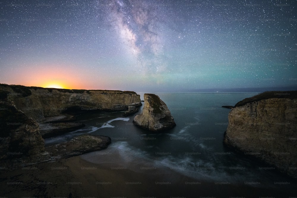 a view of the night sky over a body of water