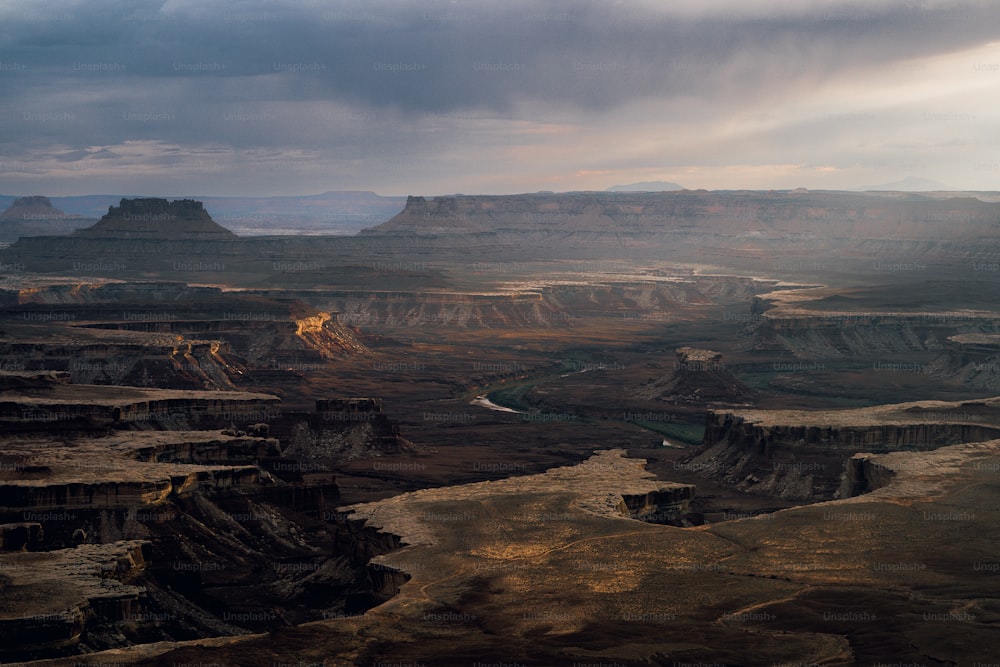 a large canyon with a river running through it