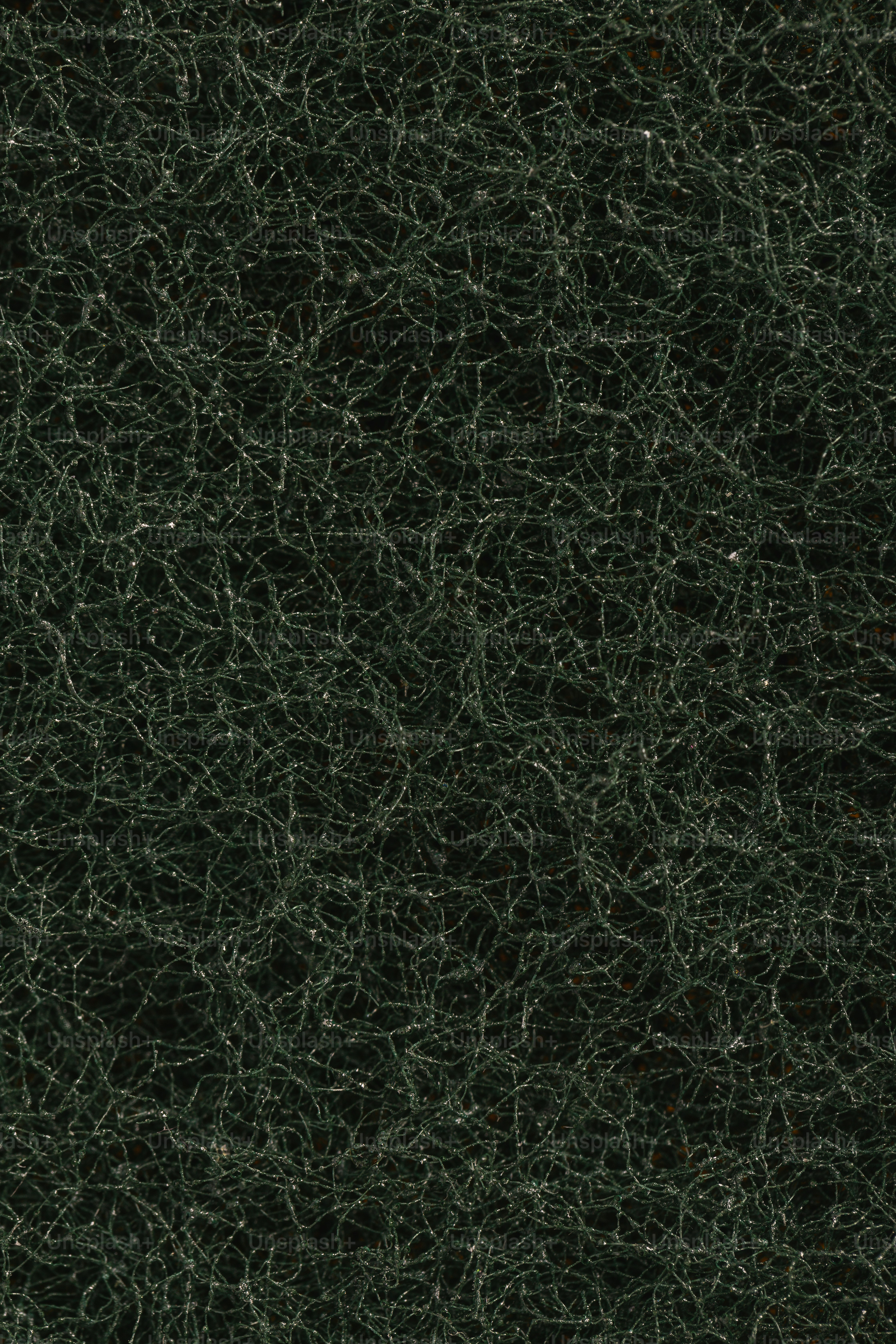 a close up of a green marble surface