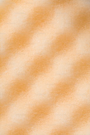 a close up of an orange and white background