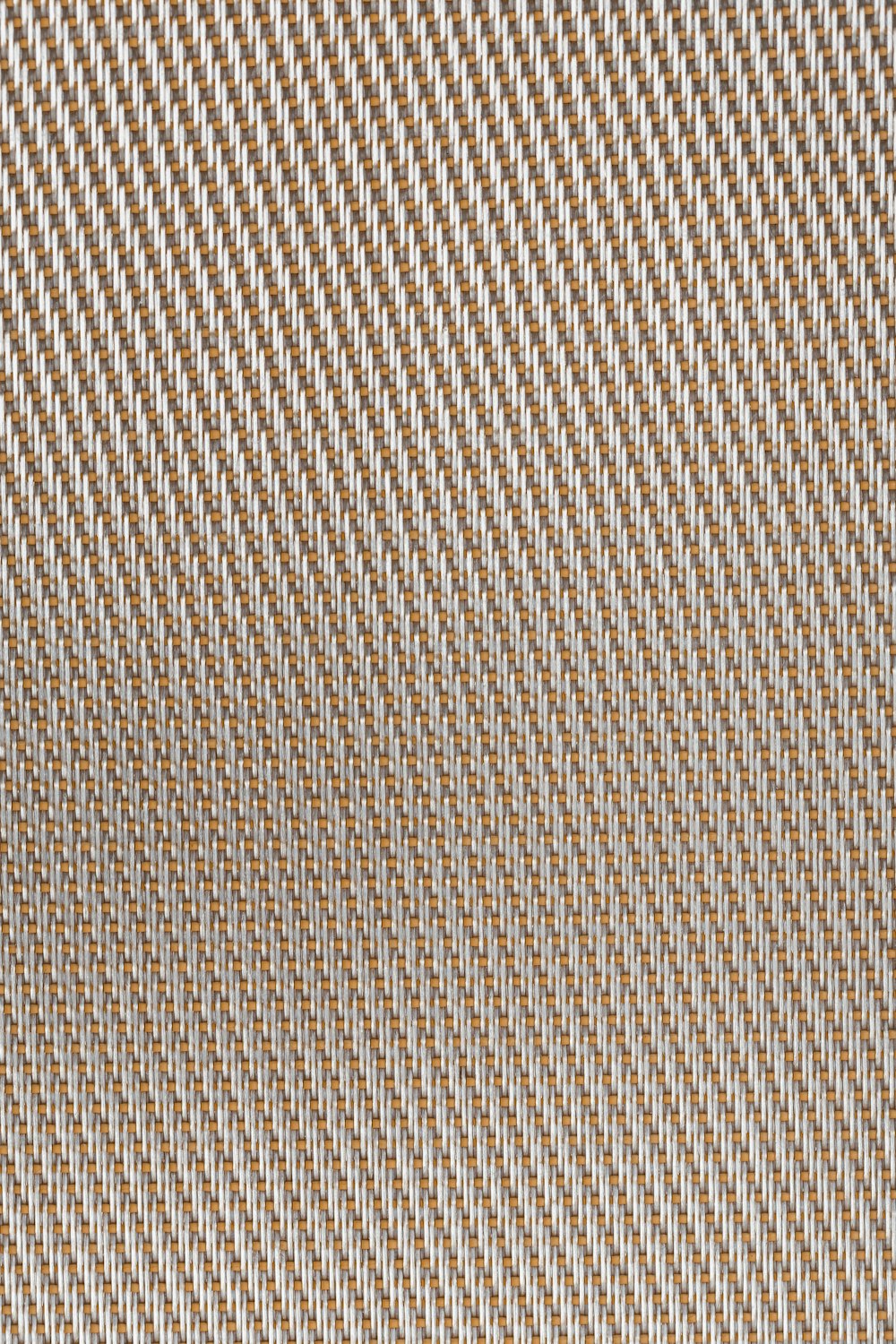 a close up view of a brown and white checkered fabric