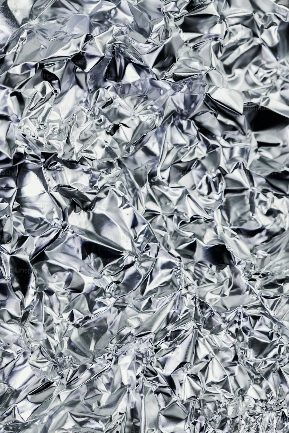 a very close up picture of a shiny surface