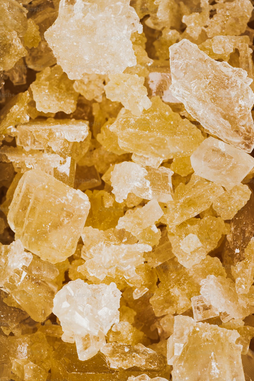 a close up of a bunch of yellow crystals