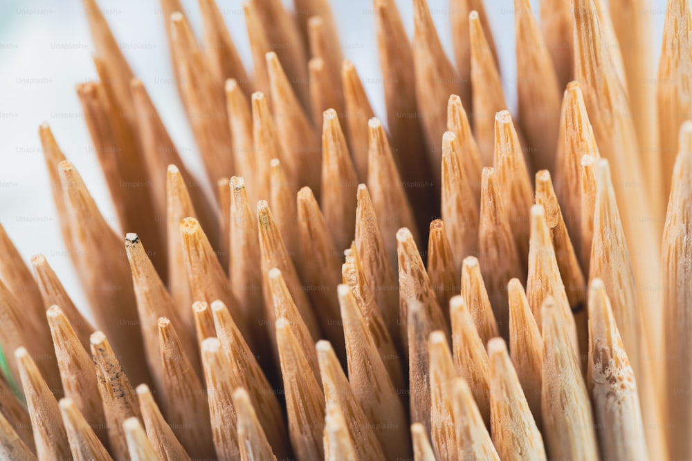 a close up of a bunch of wooden sticks