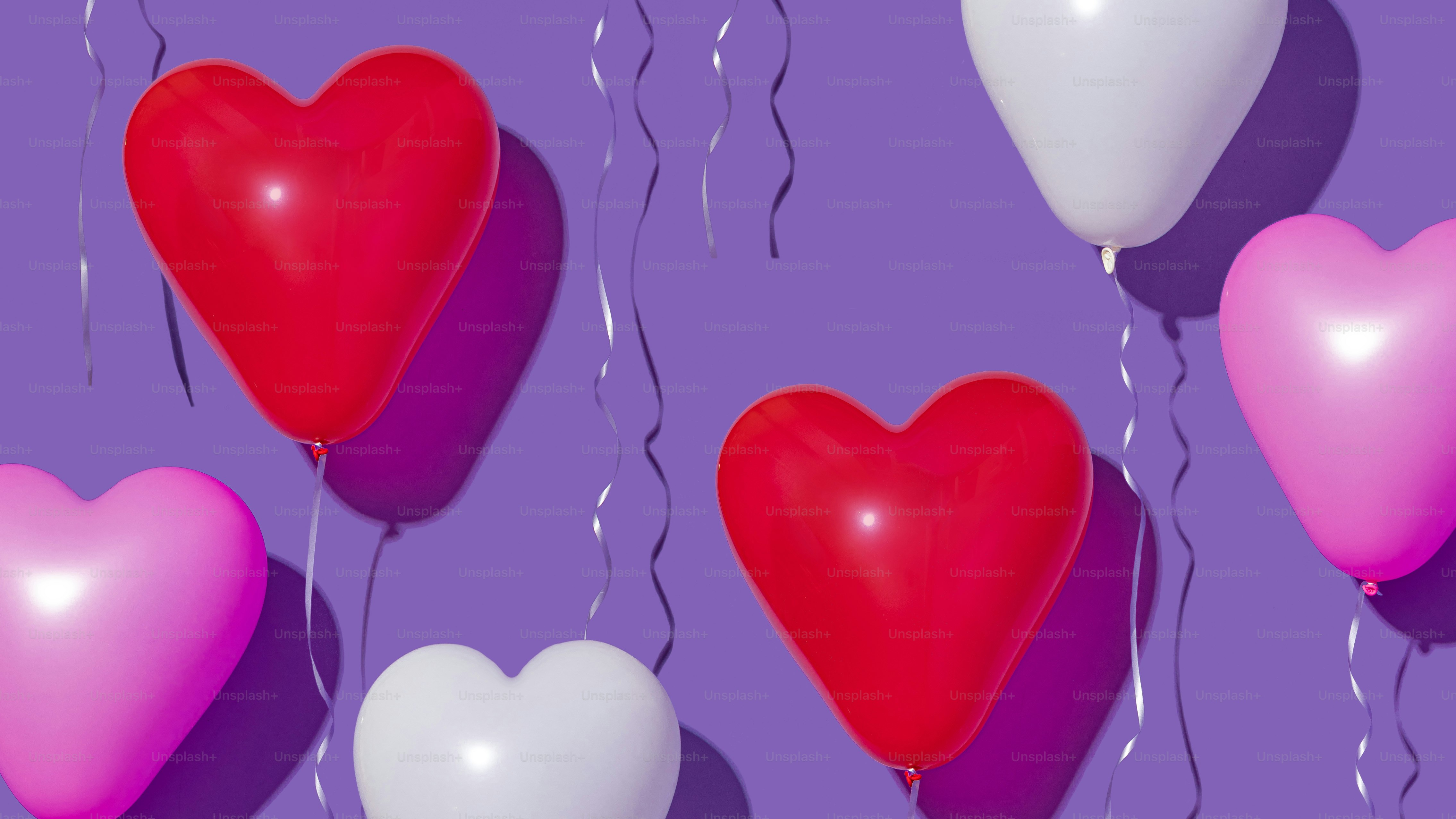 Three heart shaped balloons floating in the air photo – Background ...
