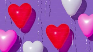 a group of heart shaped balloons floating in the air