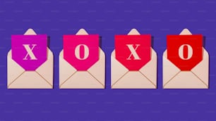 a set of three envelopes with the word xoxo printed on them