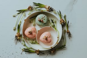 a white plate topped with three donuts covered in frosting