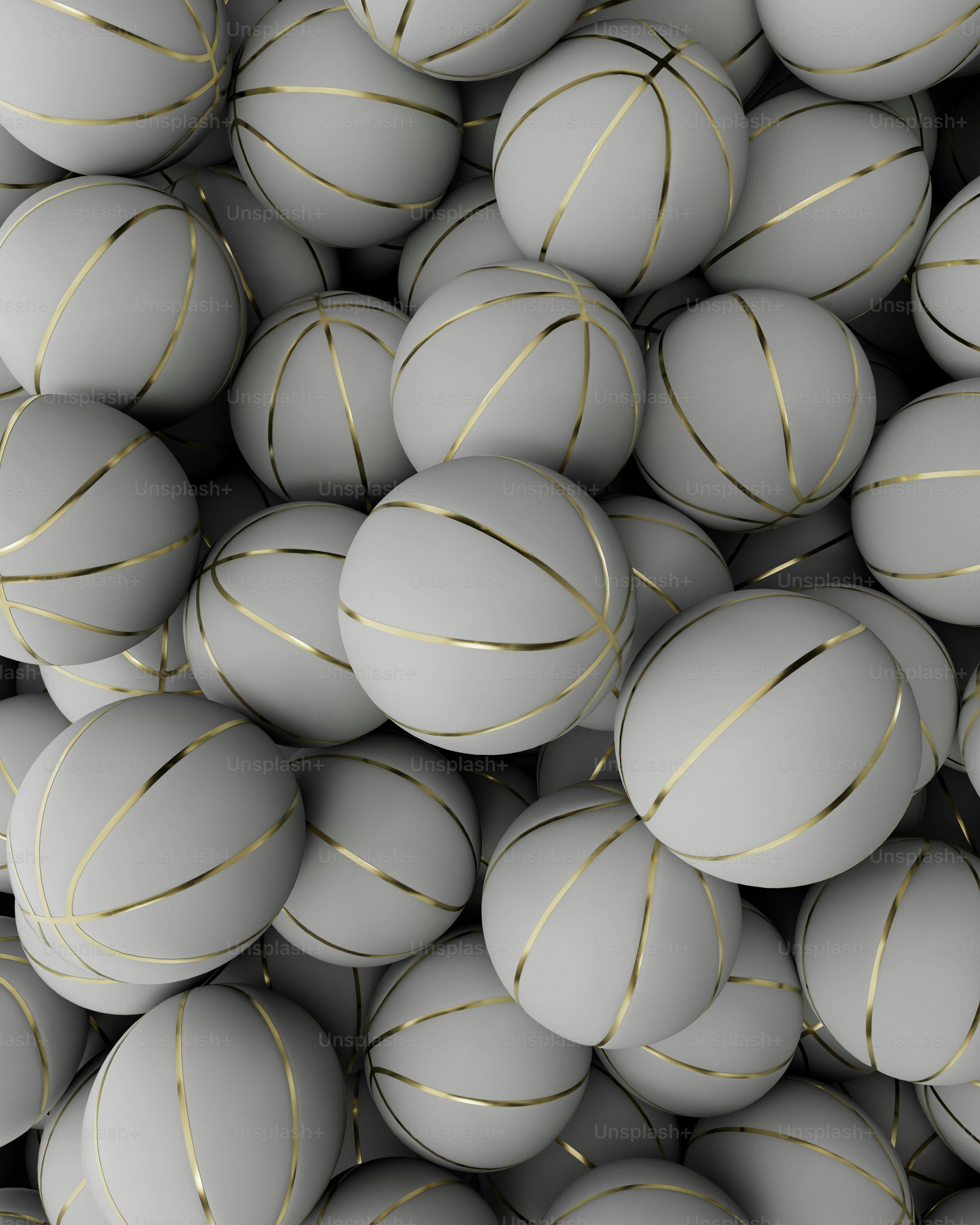 a pile of white balls with gold lines on them