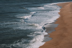 a beach with waves coming in to the shore