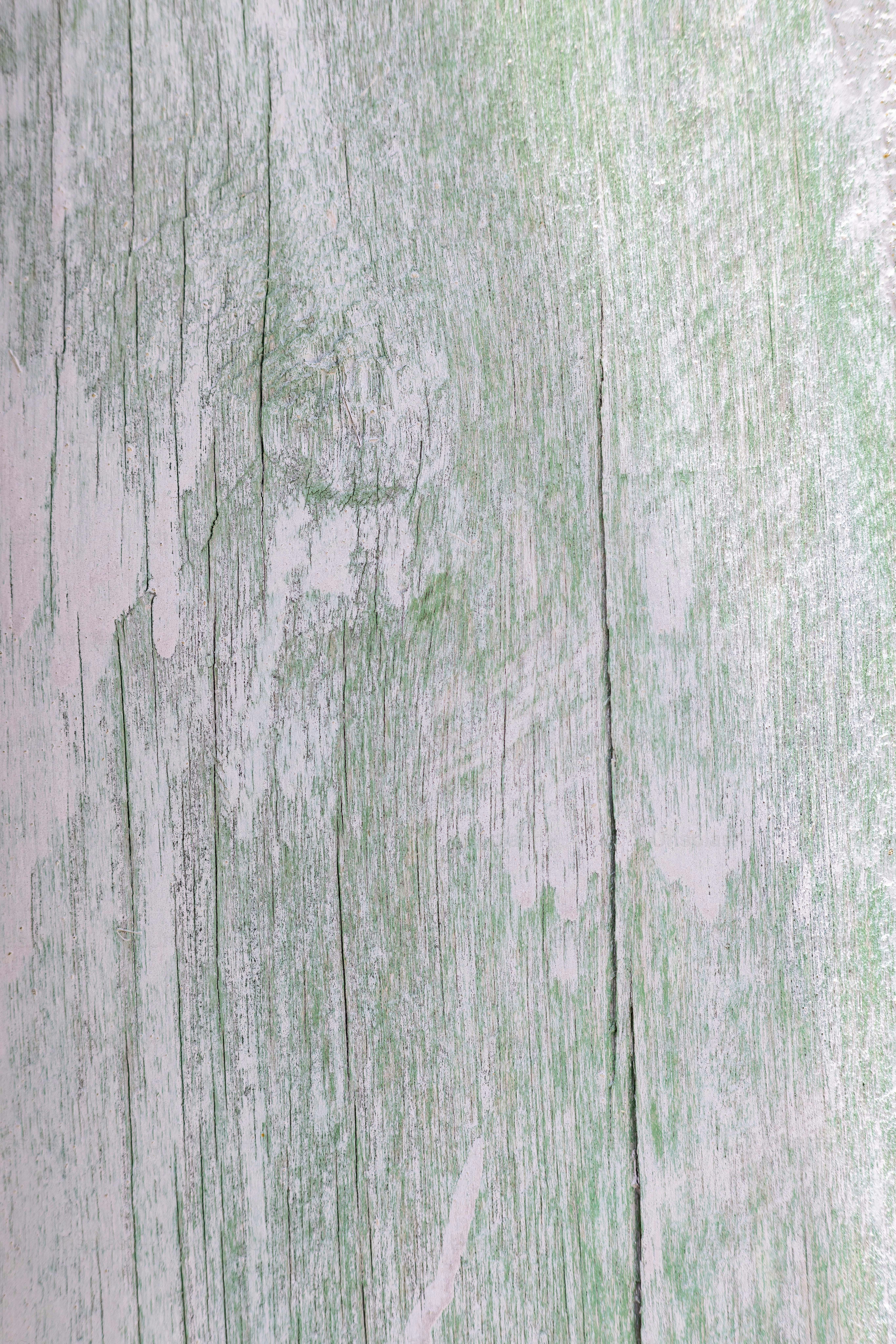 A close up of a wooden surface with peeling paint photo – Wood ...