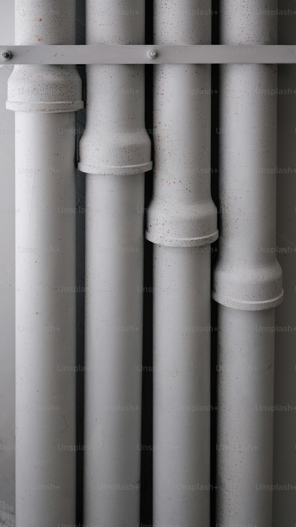 a close up of a row of white pipes