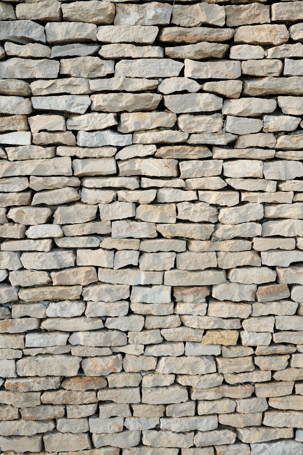 a stone wall made of small rocks