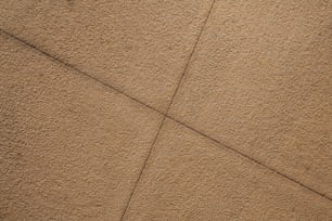 a close up of a concrete surface with a line drawn across it