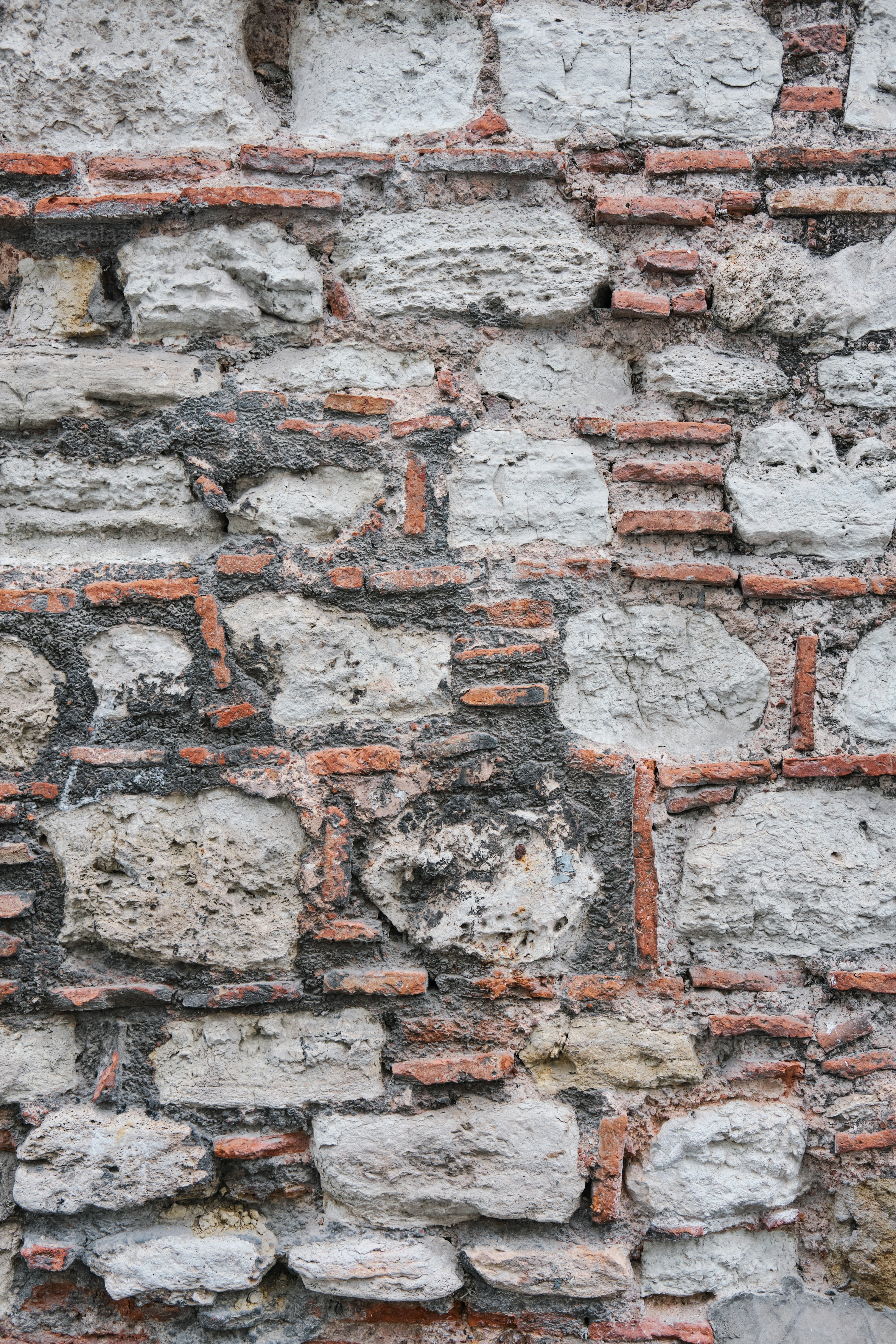 a brick wall with a clock on it