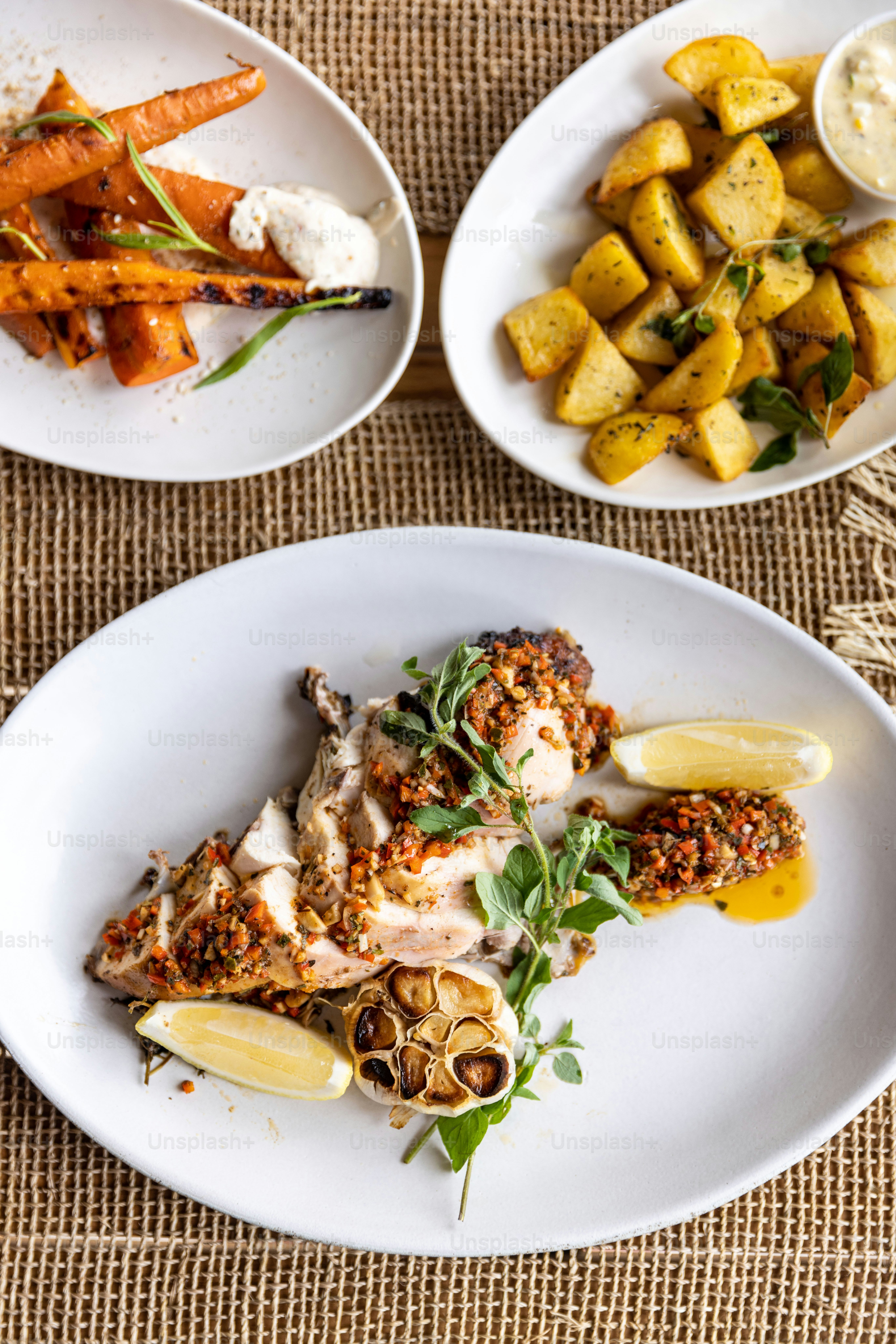 a white plate topped with meat and vegetables