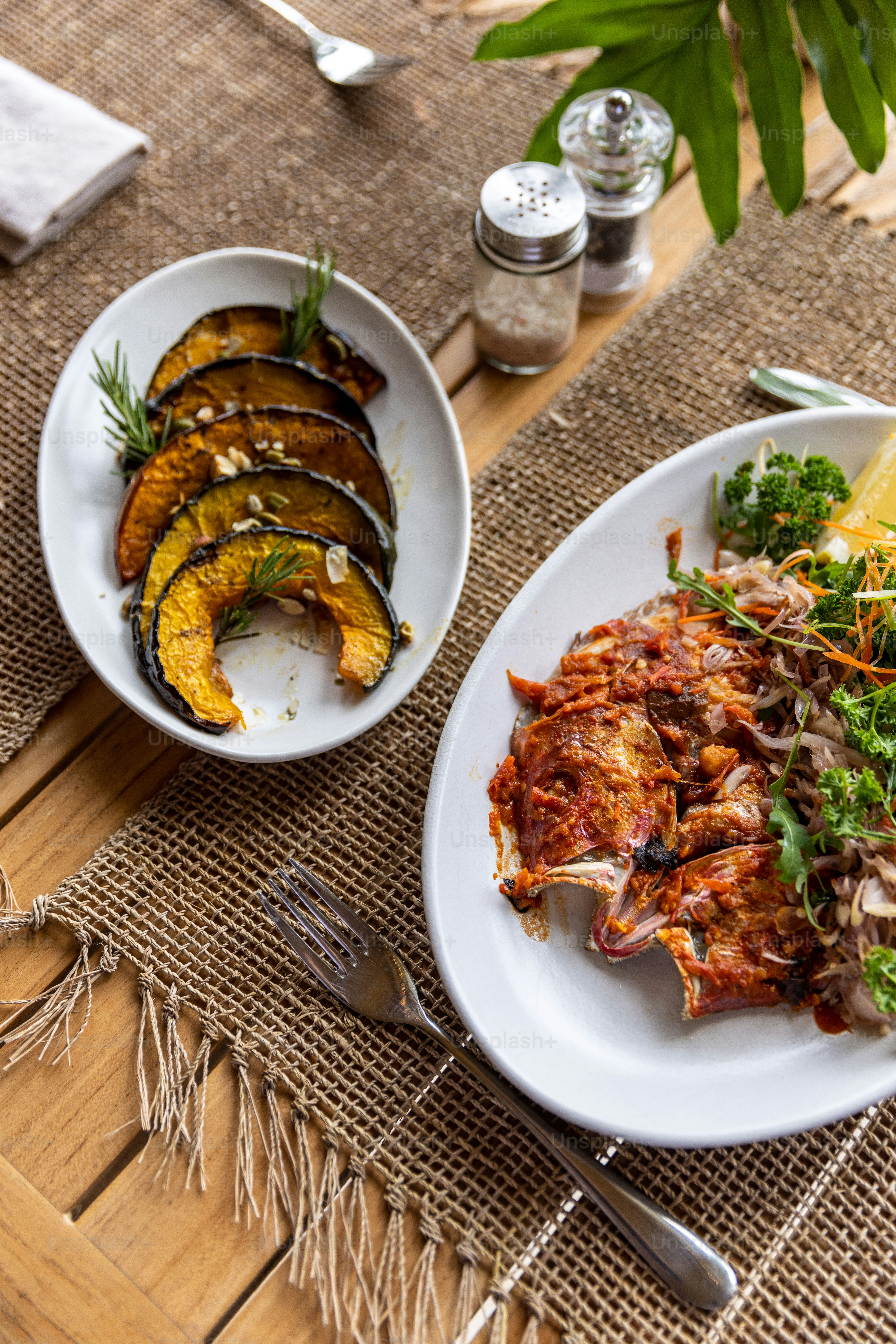 a plate of food on a table with utensils