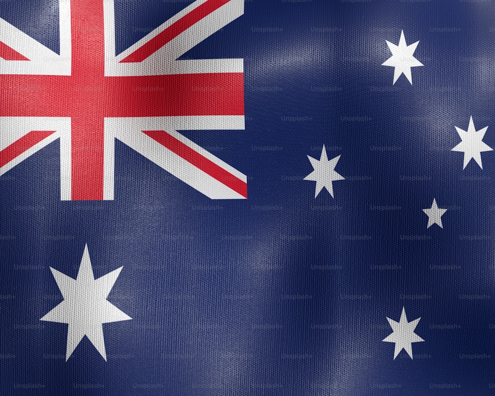 the flag of australia is waving in the wind