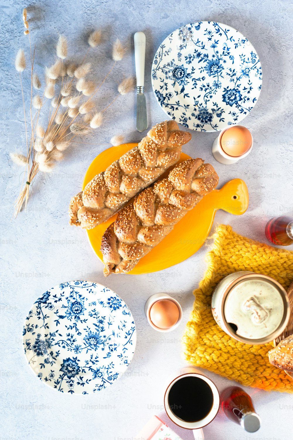 a table topped with plates and bowls filled with food