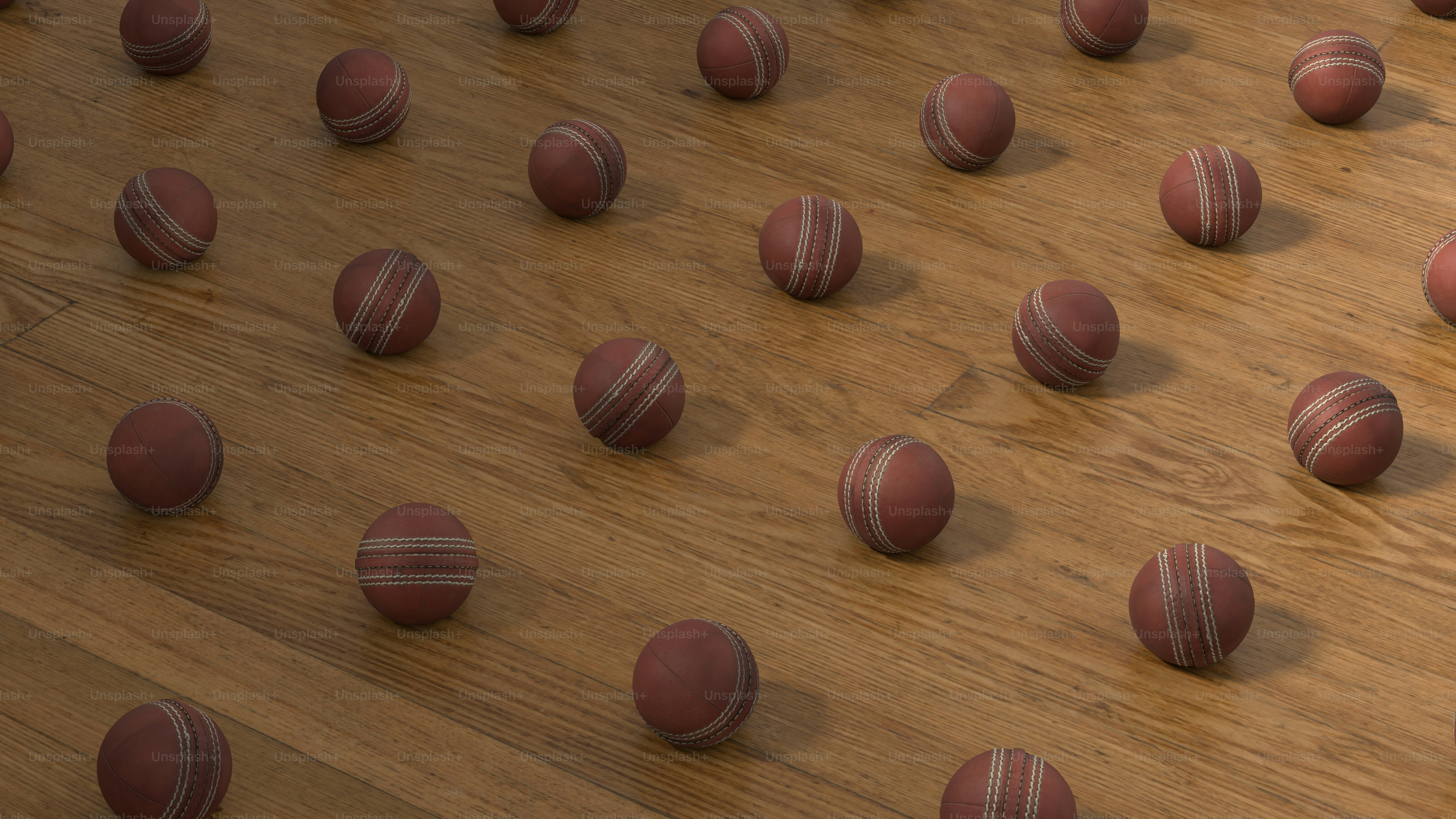 A group of red balls sitting on top of a wooden floor photo – Fitness ...