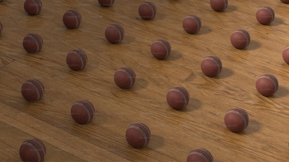 a group of red and white balls sitting on top of a wooden floor
