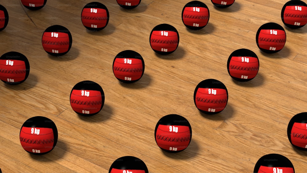 a group of red balls sitting on top of a wooden floor