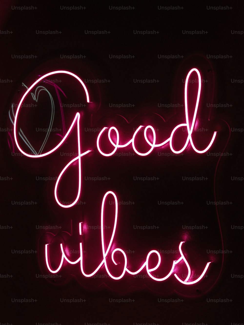 a neon sign that says good vibes