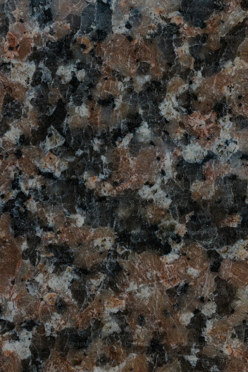 Eine Nahaufnahme einer Marmoroberfläche, die wie Granit aussieht