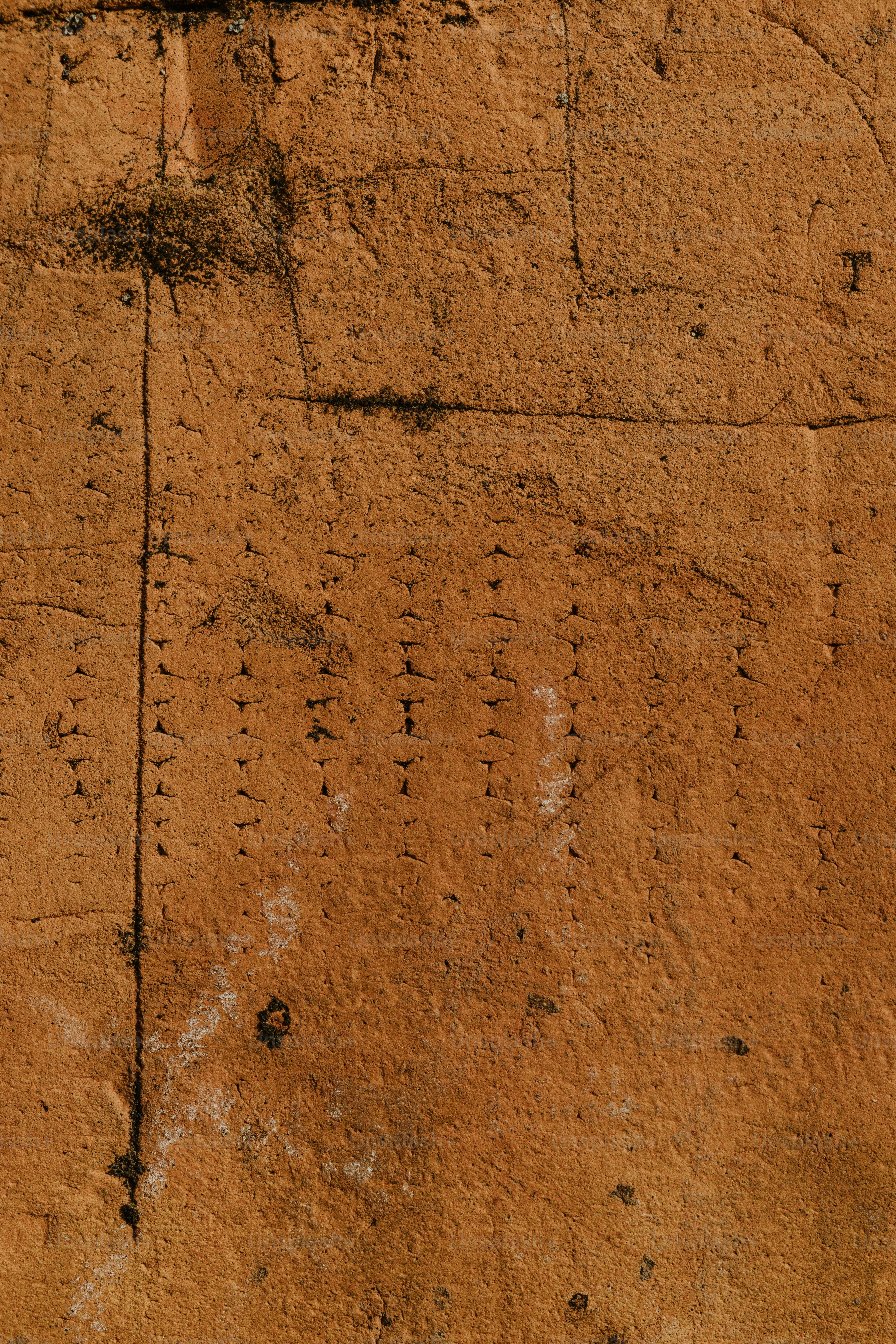 a close up of a wall with a clock on it