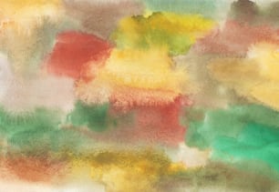 Ein abstraktes Gemälde aus gelben, grünen und roten Farben