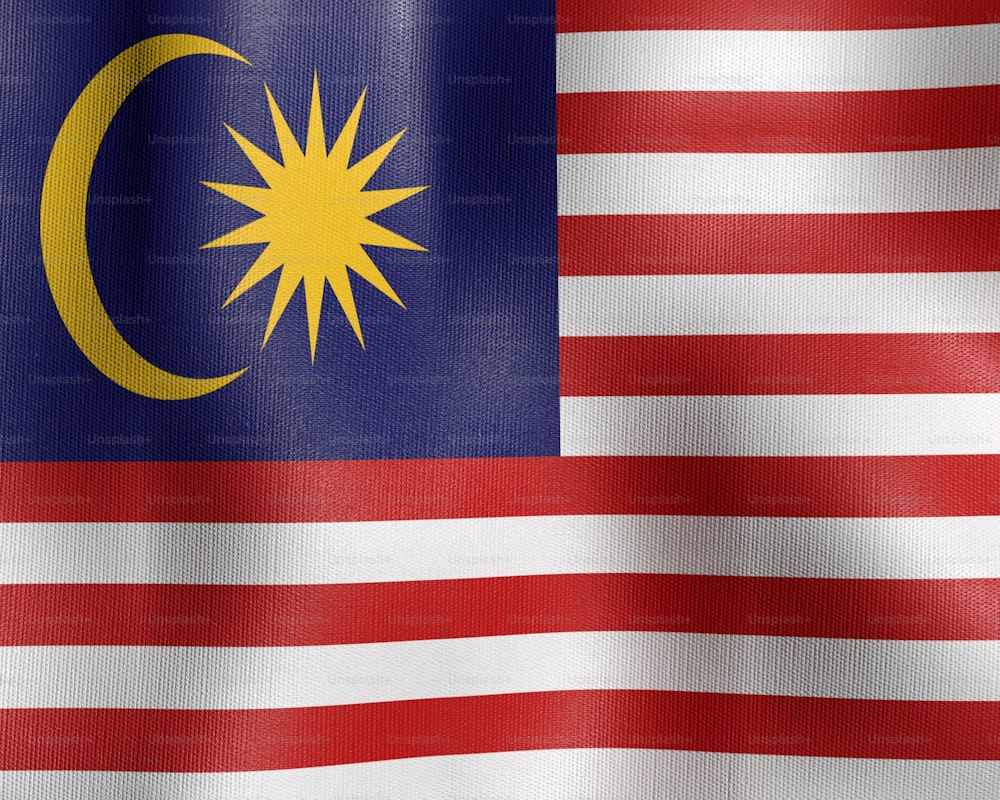 the flag of malaysia is waving in the wind