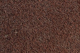 Un primer plano de una textura de alfombra marrón