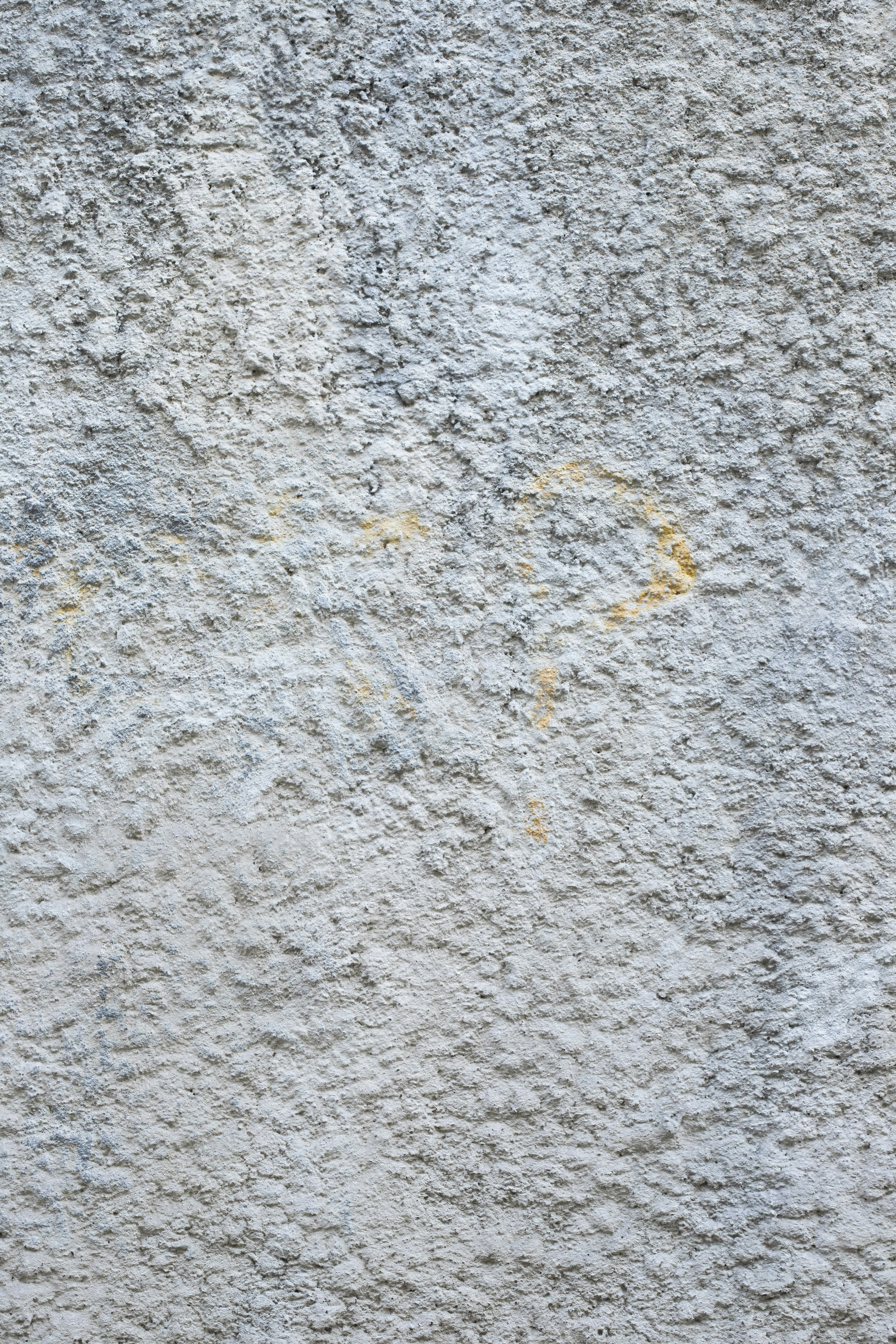 a close up of a wall with a clock on it