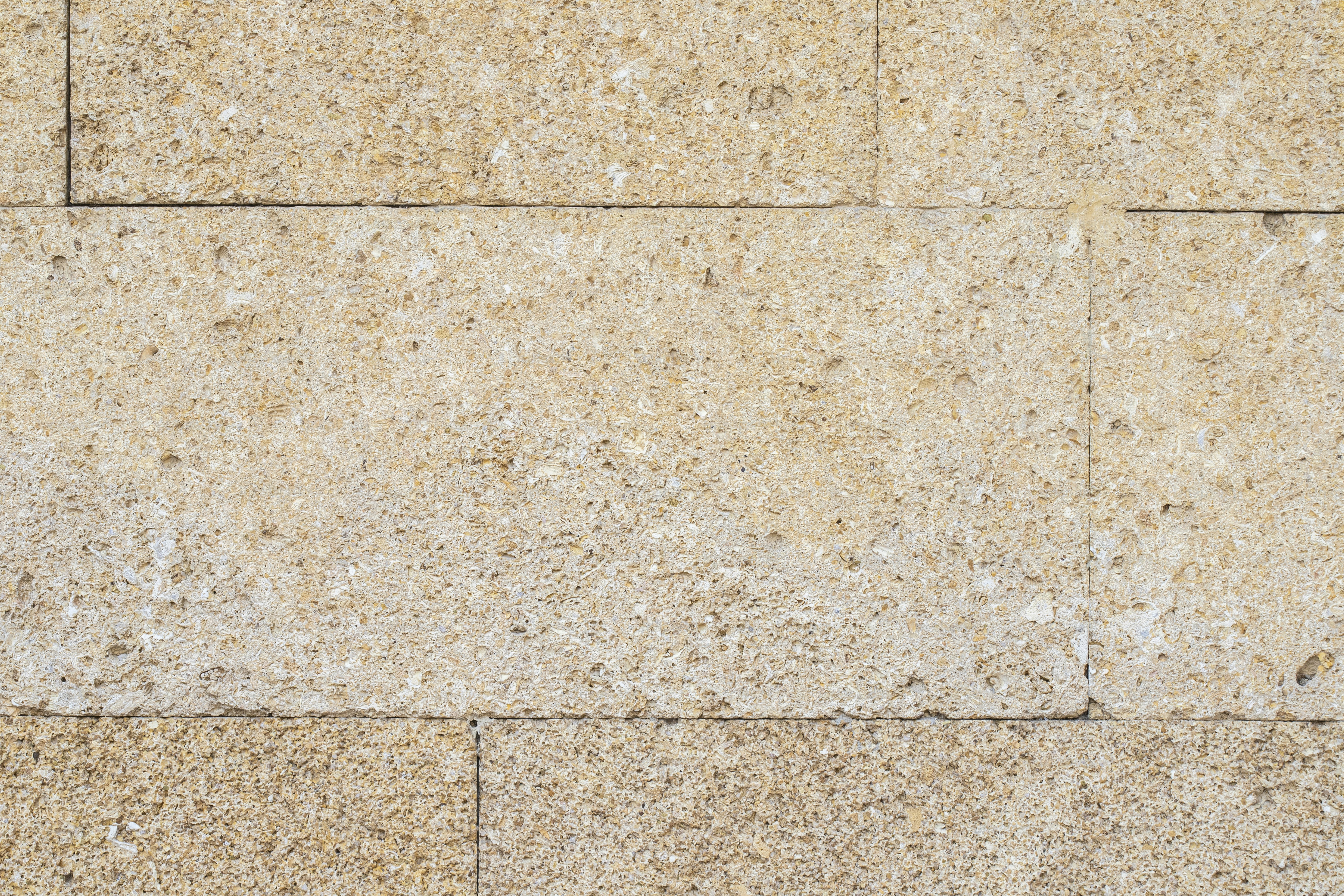 a red fire hydrant sitting on the side of a wall