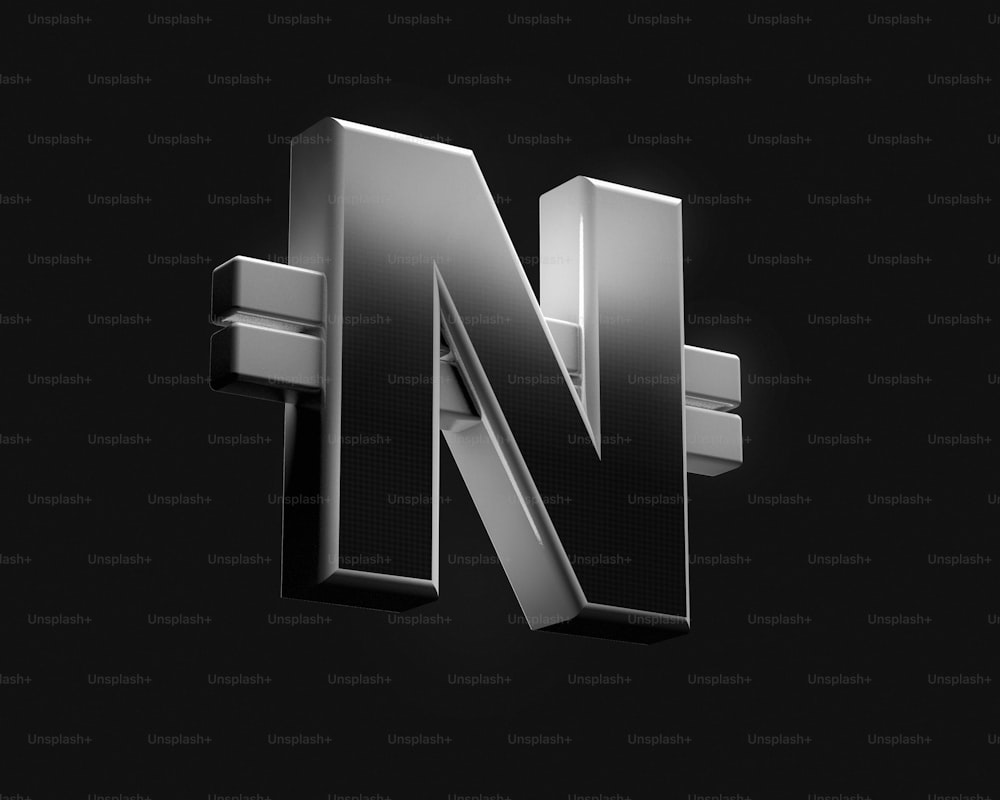 a metallic letter n on a black background