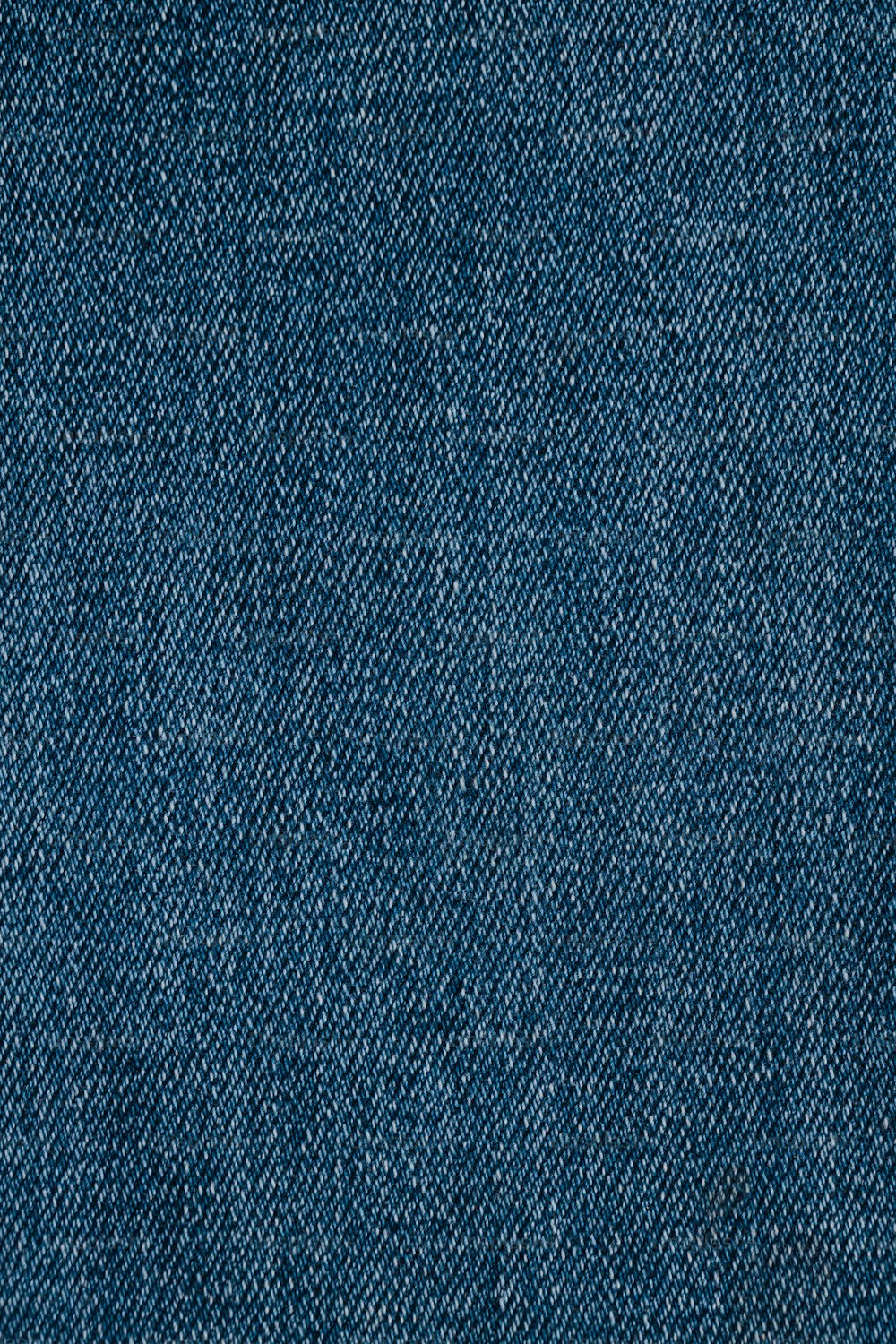 um close up de uma textura de tecido jeans azul