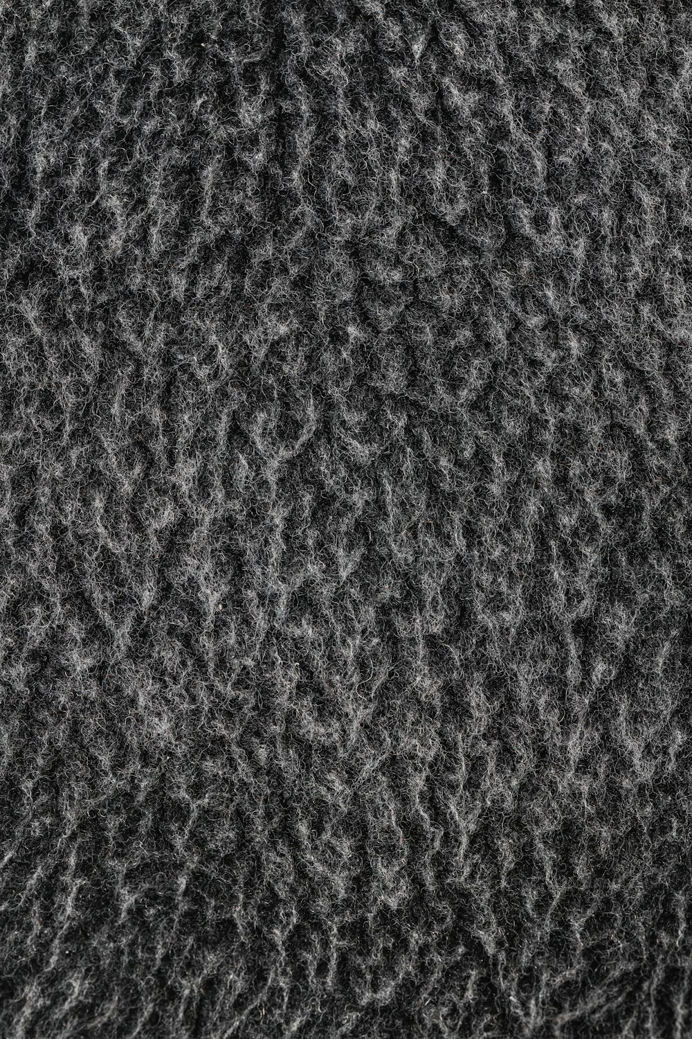 a close up of a black and white textured surface