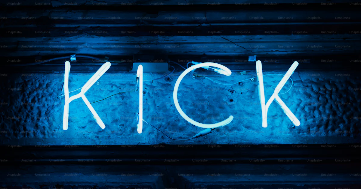 A neon sign that reads kick on a wall photo – Kick Image on Unsplash