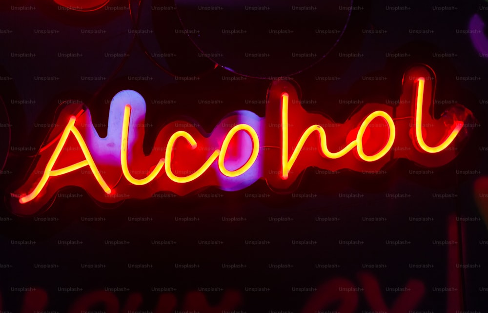 a neon sign that says alcohol on it