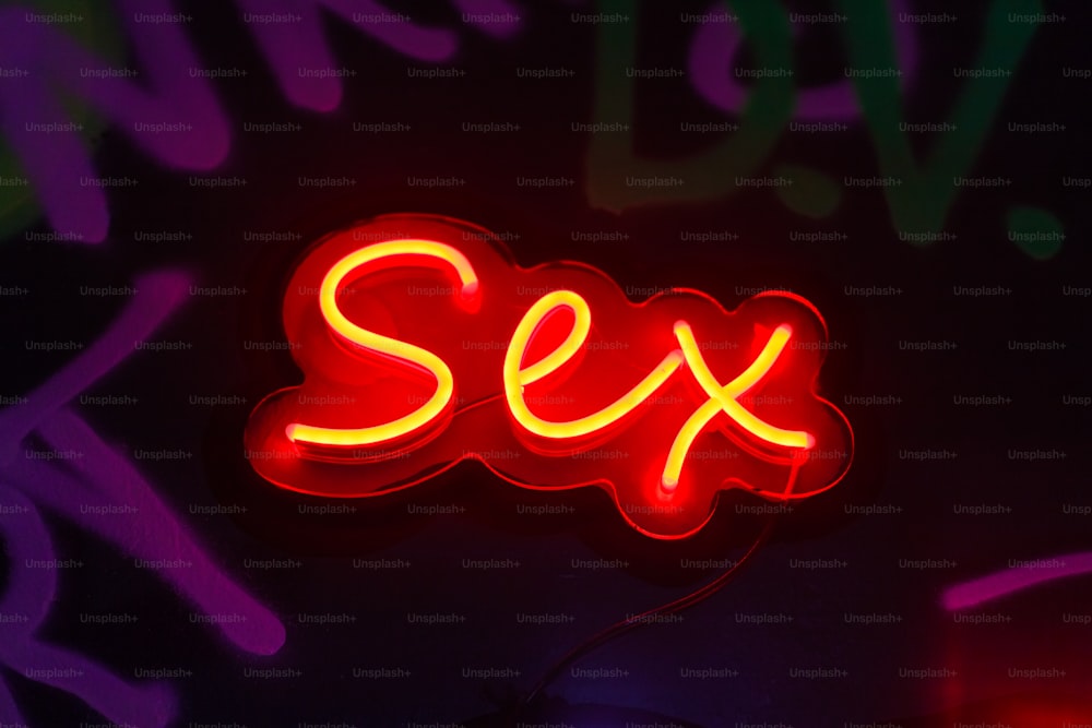 a neon sign that says sex on it