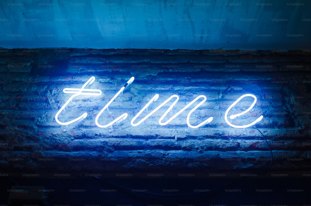 a neon sign on a brick wall that says elune
