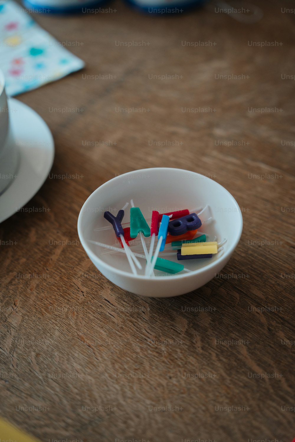 a bowl of toothbrushes sitting on a table