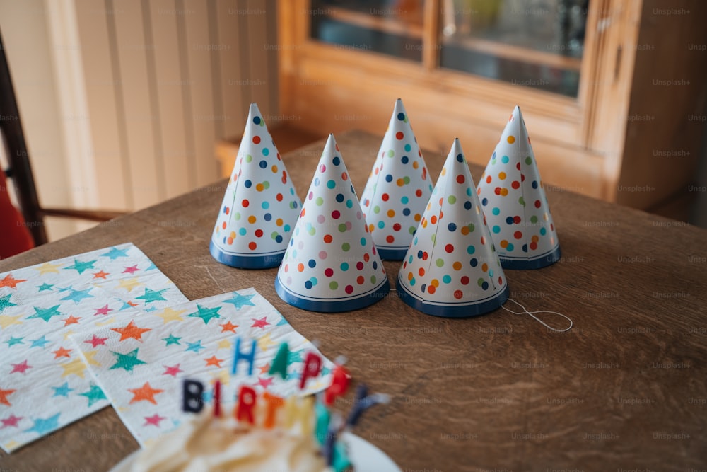 a group of birthday hats sitting on top of a table