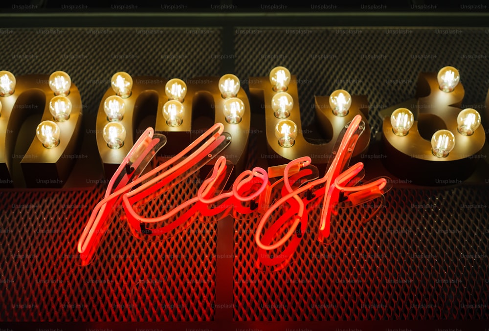 a neon sign that says self with some lights on it