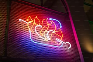 a neon sign that is on the side of a building