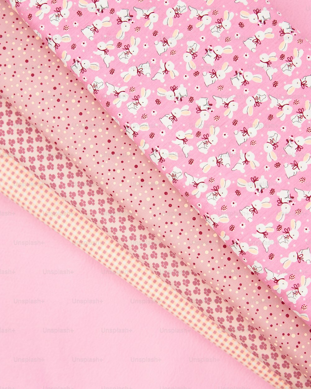 a close up of a pink background with different patterns