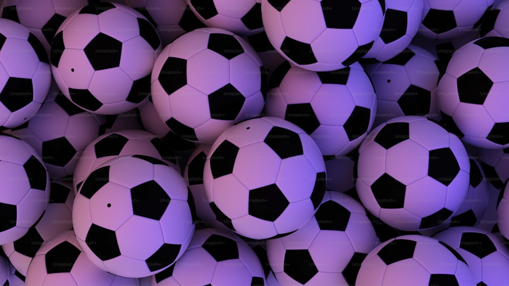 a pile of purple and black soccer balls