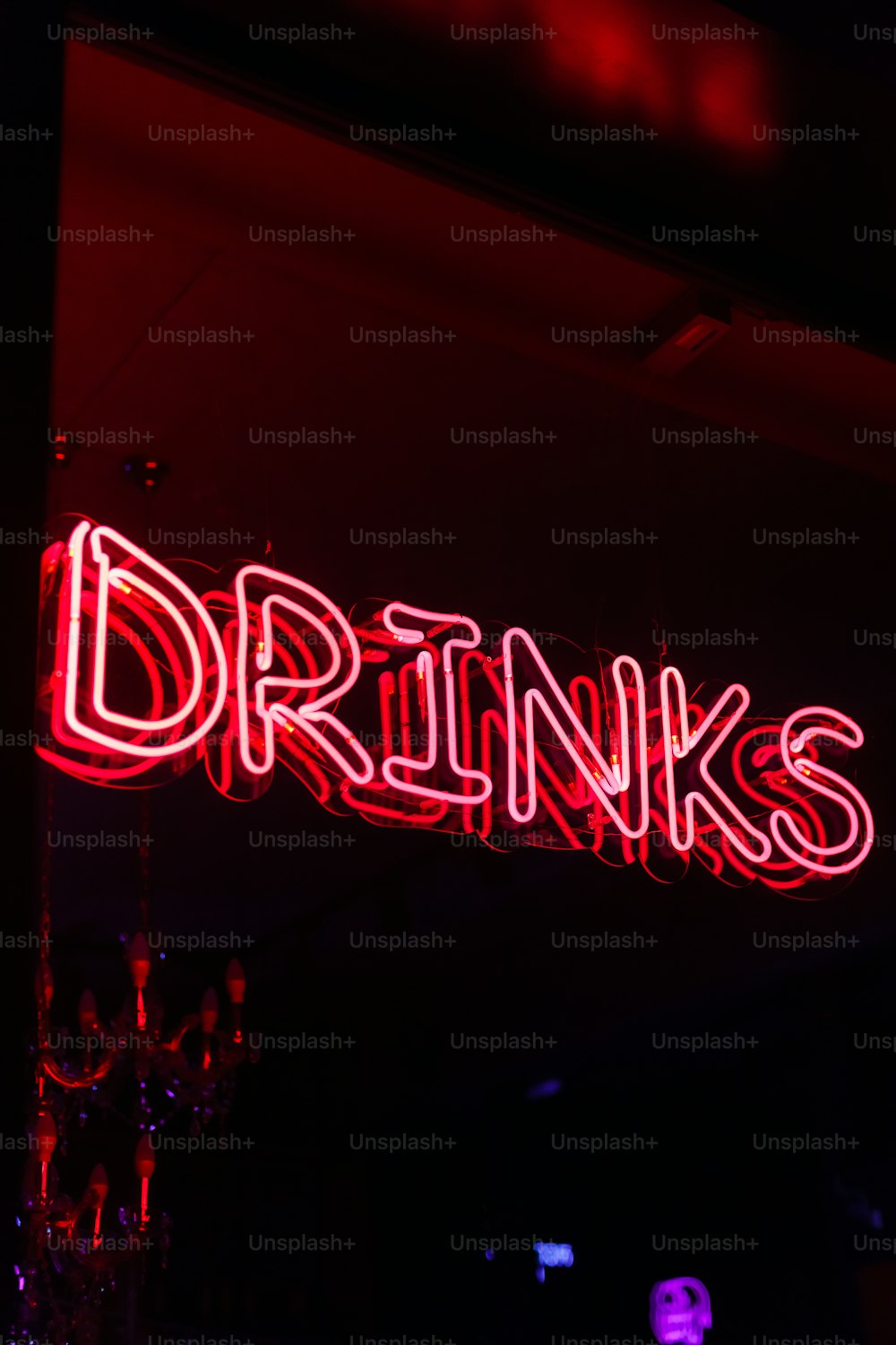 a neon sign that says drinks on it