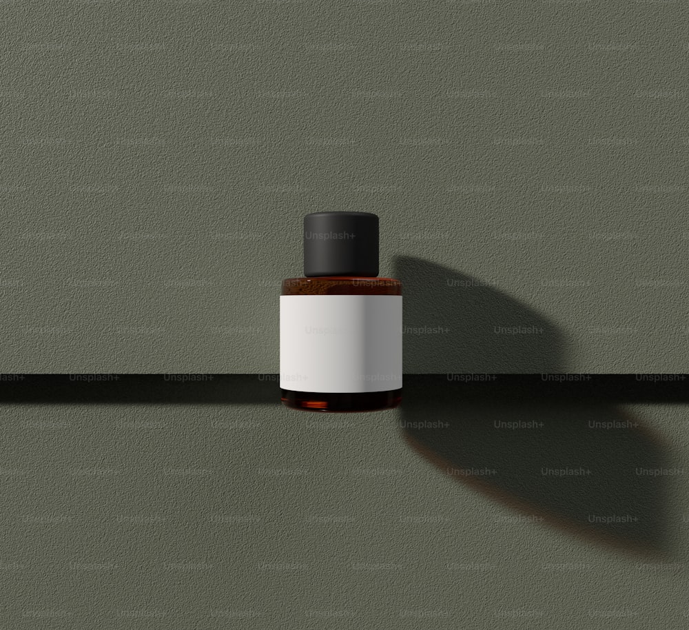 a bottle of cologne sitting on a shelf