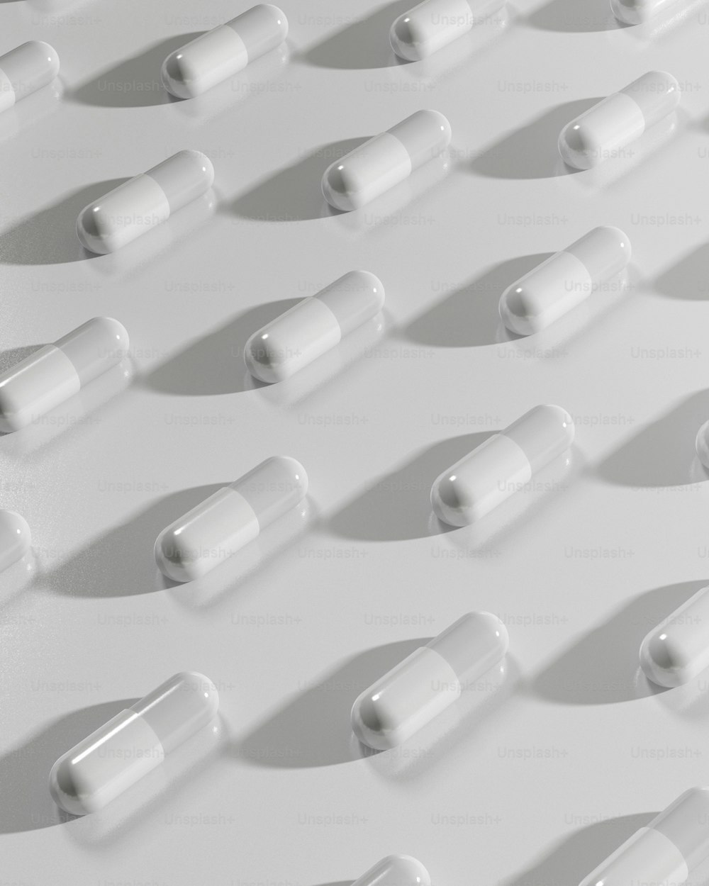 several pills lined up on a white surface